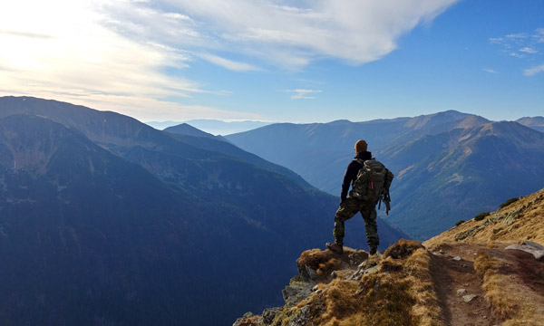 man standing on mountain