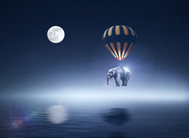 Full Moon with elephant hanging from balloon