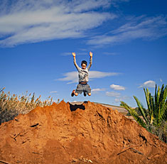 Sabian Symbol for Scorpio 15: Children playing near 5 mounds of sand.